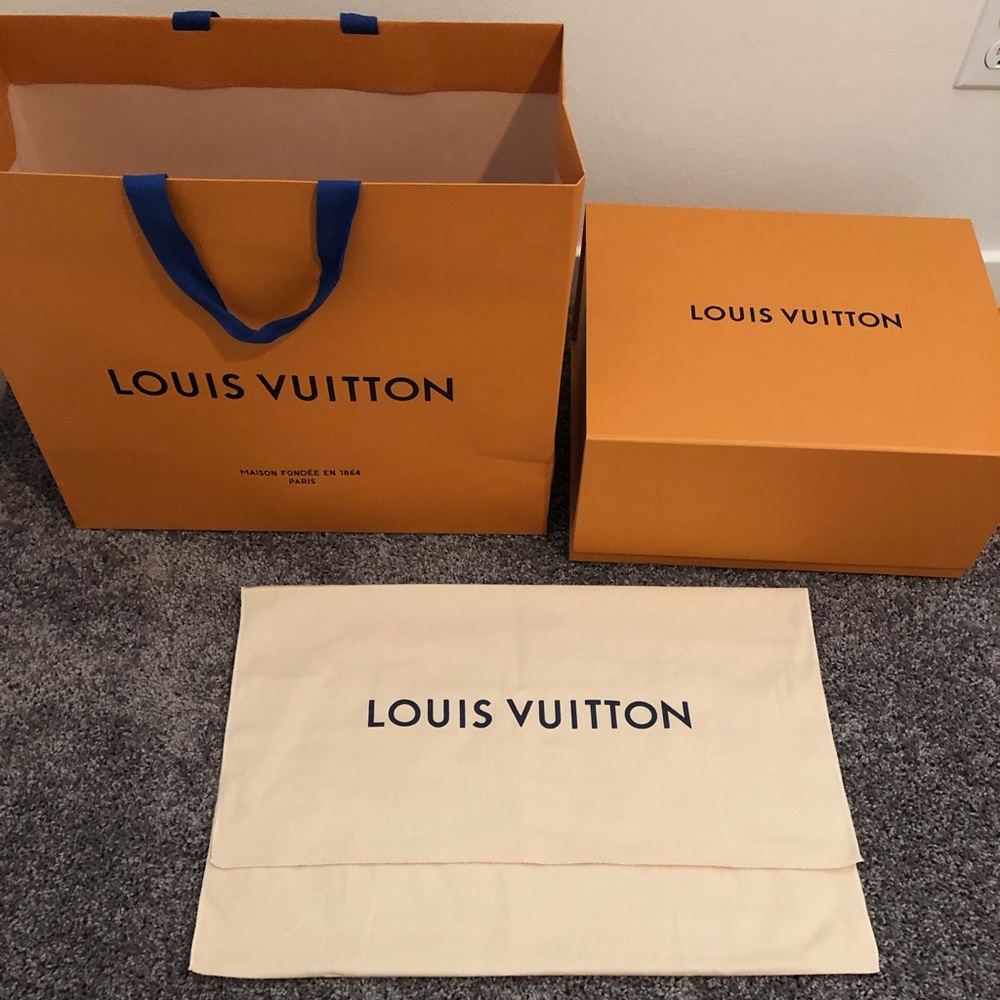 Louis Vuitton large bag, dust cover, and box.